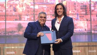 Ivan Filletti being presented with the SiGMA Vision 2030 book.