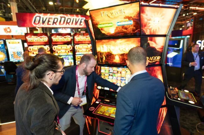 Thrills, entertainment and the chance to win big – both the Link Overdrive jackpot system and the Dragor jackpot feature quickly became crowd favourites at the Merkur booth. (Photo: Adam Sternberg)
